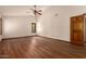 Spacious bedroom features hardwood floors, neutral paint, and ample natural light at 1637 S Los Alamos Cir, Mesa, AZ 85204