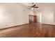 Bedroom with hardwood floors, neutral paint, ceiling fan and windows at 1637 S Los Alamos Cir, Mesa, AZ 85204