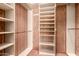 Walk in closet with custom shelving and storage options at 1637 S Los Alamos Cir, Mesa, AZ 85204