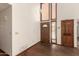 Bright entryway with hardwood floors, high ceilings, and natural light from sidelight windows at 1637 S Los Alamos Cir, Mesa, AZ 85204