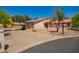 Charming property with a terracotta roof, desert landscaping, and a horseshoe driveway at 1637 S Los Alamos Cir, Mesa, AZ 85204