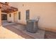 Exterior view of the property with a patio and air conditioning unit at 1637 S Los Alamos Cir, Mesa, AZ 85204