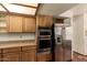 Kitchen features stainless steel appliances and wood cabinetry at 1637 S Los Alamos Cir, Mesa, AZ 85204