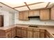 Kitchen features wood cabinets and countertops at 1637 S Los Alamos Cir, Mesa, AZ 85204