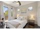 Comfortable bedroom with natural light from a large window leading to an outdoor patio at 16600 N Thompson Peak Pkwy # 2050, Scottsdale, AZ 85260