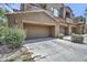 Exterior shot showing garages of townhomes on a sunny day at 16600 N Thompson Peak Pkwy # 2050, Scottsdale, AZ 85260