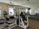 Well-equipped fitness center featuring weight machines, dumbbells, and cardio equipment for resident use at 16600 N Thompson Peak Pkwy # 2050, Scottsdale, AZ 85260