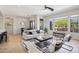 Bright living space with stylish furnishings, large windows, and an adjacent dining area, perfect for modern living at 16600 N Thompson Peak Pkwy # 2050, Scottsdale, AZ 85260