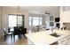 Open-concept space with kitchen island, dining area, and inviting living room at 16600 N Thompson Peak Pkwy # 2050, Scottsdale, AZ 85260