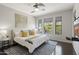 Serene main bedroom with a ceiling fan, large windows with a scenic view, and a tv at 16600 N Thompson Peak Pkwy # 2050, Scottsdale, AZ 85260