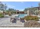 Community pool with lounge chairs and lush landscaping; great for relaxation at 16600 N Thompson Peak Pkwy # 2050, Scottsdale, AZ 85260