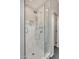 Luxurious walk-in shower featuring white marble tiling, glass surround, and modern fixtures at 16600 N Thompson Peak Pkwy # 2050, Scottsdale, AZ 85260