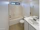 Bathroom features a tiled shower/tub combo and a vanity sink at 16753 N 157Th Ave, Surprise, AZ 85374