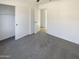 Bright, airy bedroom with neutral carpet and open closet for a clean, minimalist feel at 16753 N 157Th Ave, Surprise, AZ 85374