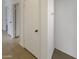 Hallway features tile flooring and a white closet door for storage at 16753 N 157Th Ave, Surprise, AZ 85374