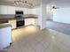Modern kitchen with stainless steel appliances and tile flooring at 16753 N 157Th Ave, Surprise, AZ 85374