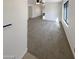 Spacious living room with large window, carpeted floors and an inviting layout for comfortable living at 16753 N 157Th Ave, Surprise, AZ 85374