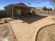 Backyard with a covered patio and decorative concrete area at 16753 N 157Th Ave, Surprise, AZ 85374