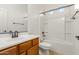 Bathroom with a vanity, sink, toilet, and a shower-tub combo at 18033 W Tecoma Rd, Goodyear, AZ 85338