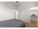 A carpeted bedroom with a ceiling fan and a walk-in closet at 18033 W Tecoma Rd, Goodyear, AZ 85338