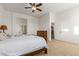Bedroom with carpeted floor, ceiling fan and ensuite bath access at 18033 W Tecoma Rd, Goodyear, AZ 85338