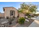 Charming single-Gathering home with desert landscaping, a two-car garage, and neutral color palette at 18033 W Tecoma Rd, Goodyear, AZ 85338