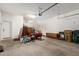 A spacious garage with storage and a seating area at 18033 W Tecoma Rd, Goodyear, AZ 85338