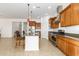 Well-equipped kitchen with granite countertops, stainless steel appliances, and a center island at 18033 W Tecoma Rd, Goodyear, AZ 85338