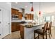 Spacious kitchen features granite countertops, stainless steel appliances, and a convenient island with bar seating at 18033 W Tecoma Rd, Goodyear, AZ 85338