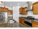 Modern kitchen with stainless steel appliances, granite countertops, and ample storage at 18033 W Tecoma Rd, Goodyear, AZ 85338