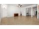 Open-concept living room featuring tile flooring and access to entryway and kitchen at 18033 W Tecoma Rd, Goodyear, AZ 85338