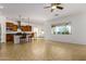 Open-concept living area showcases kitchen with island seating and outdoor views at 18033 W Tecoma Rd, Goodyear, AZ 85338
