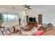 Comfortable living room with a leather sectional sofa, stylish decor, and a view of the outdoors at 18033 W Tecoma Rd, Goodyear, AZ 85338