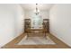 Bright office with a large window, wooden desk, and shelving at 18033 W Tecoma Rd, Goodyear, AZ 85338