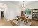 Home office featuring a large window, desk, and modern decor at 18033 W Tecoma Rd, Goodyear, AZ 85338