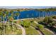 Scenic view of the lake with palm trees lining the landscaped walking path at 18033 W Tecoma Rd, Goodyear, AZ 85338