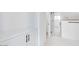 Bright bathroom featuring white cabinetry with black hardware and a glass enclosed shower, creating a clean and modern space at 18123 W Hiddenview Dr, Goodyear, AZ 85338