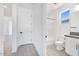 Bright bathroom with a tub, toilet, and vanity featuring black hardware and stone countertops at 18123 W Hiddenview Dr, Goodyear, AZ 85338