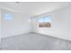 Spacious bedroom with carpet and lots of natural light at 18123 W Hiddenview Dr, Goodyear, AZ 85338