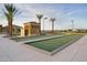 Bocce Ball Court with palms and beautiful landscaping for friendly competition at 18123 W Hiddenview Dr, Goodyear, AZ 85338