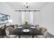 Elegant dining room with modern chandelier and ample seating for gatherings at 18123 W Hiddenview Dr, Goodyear, AZ 85338