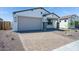 Charming single-Gathering home with a brick driveway and a well-maintained front yard, offering great curb appeal at 18123 W Hiddenview Dr, Goodyear, AZ 85338