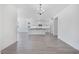 Open-concept kitchen with white cabinetry, dark countertops, and stainless steel appliances at 18123 W Hiddenview Dr, Goodyear, AZ 85338