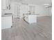 Modern kitchen with white cabinets, gray countertops and stainless steel appliances at 18123 W Hiddenview Dr, Goodyear, AZ 85338
