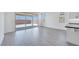 Bright open room with access to the backyard through sliding glass doors at 18123 W Hiddenview Dr, Goodyear, AZ 85338