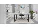 Bright and airy office space with modern furniture, large windows, and built-in shelving at 18123 W Hiddenview Dr, Goodyear, AZ 85338
