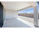 Covered patio space, perfect for outdoor relaxation and entertainment, leading to a private backyard at 18123 W Hiddenview Dr, Goodyear, AZ 85338
