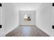 Bright bedroom featuring wood-look tile flooring and a window at 18150 W Tanglewood Dr, Goodyear, AZ 85338