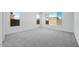 Bedroom with carpet, large windows, and natural light at 18150 W Tanglewood Dr, Goodyear, AZ 85338