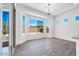 Dining room with a bay window and wood-look floors at 18150 W Tanglewood Dr, Goodyear, AZ 85338